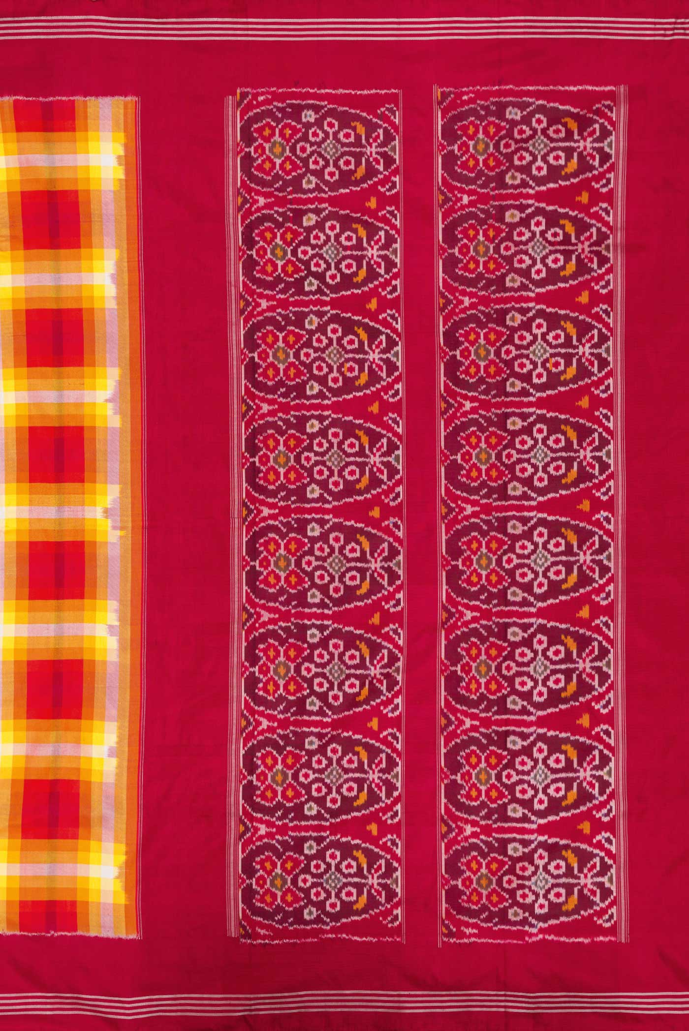Close up image of the pallu of Mustard Dual Tone Double Ikat Saree with Checked design on the body and Zari Border. 