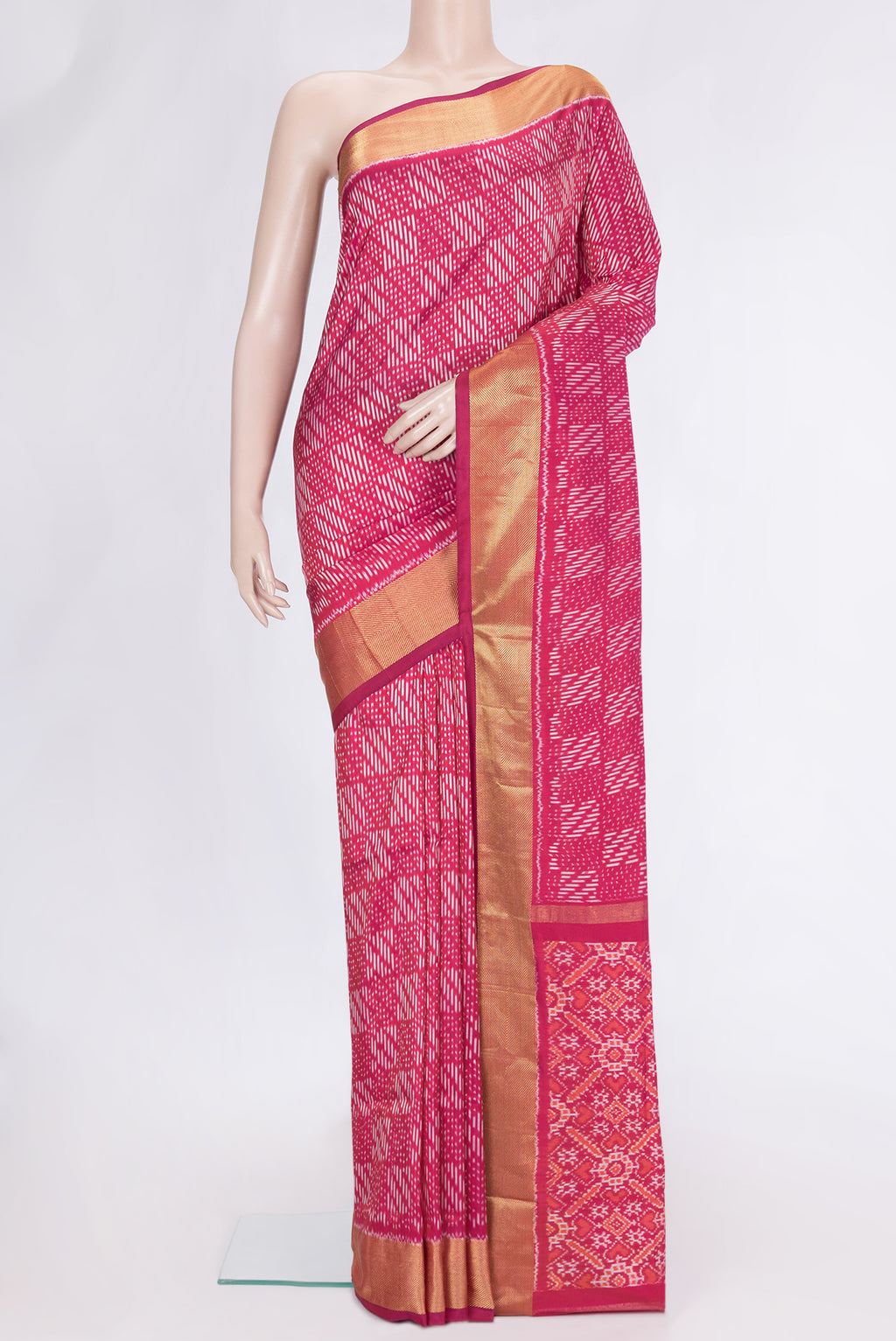 Pink Dual Tone Double Ikat Saree with Ikat Print on the body and Zari Border.  displayed on a mannequin