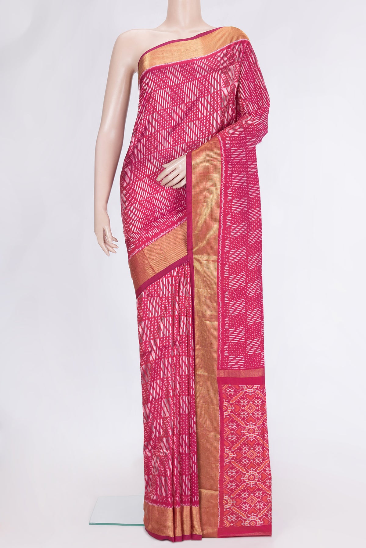 Pink Dual Tone Double Ikat Saree with Ikat Print on the body and Zari Border.  displayed on a mannequin