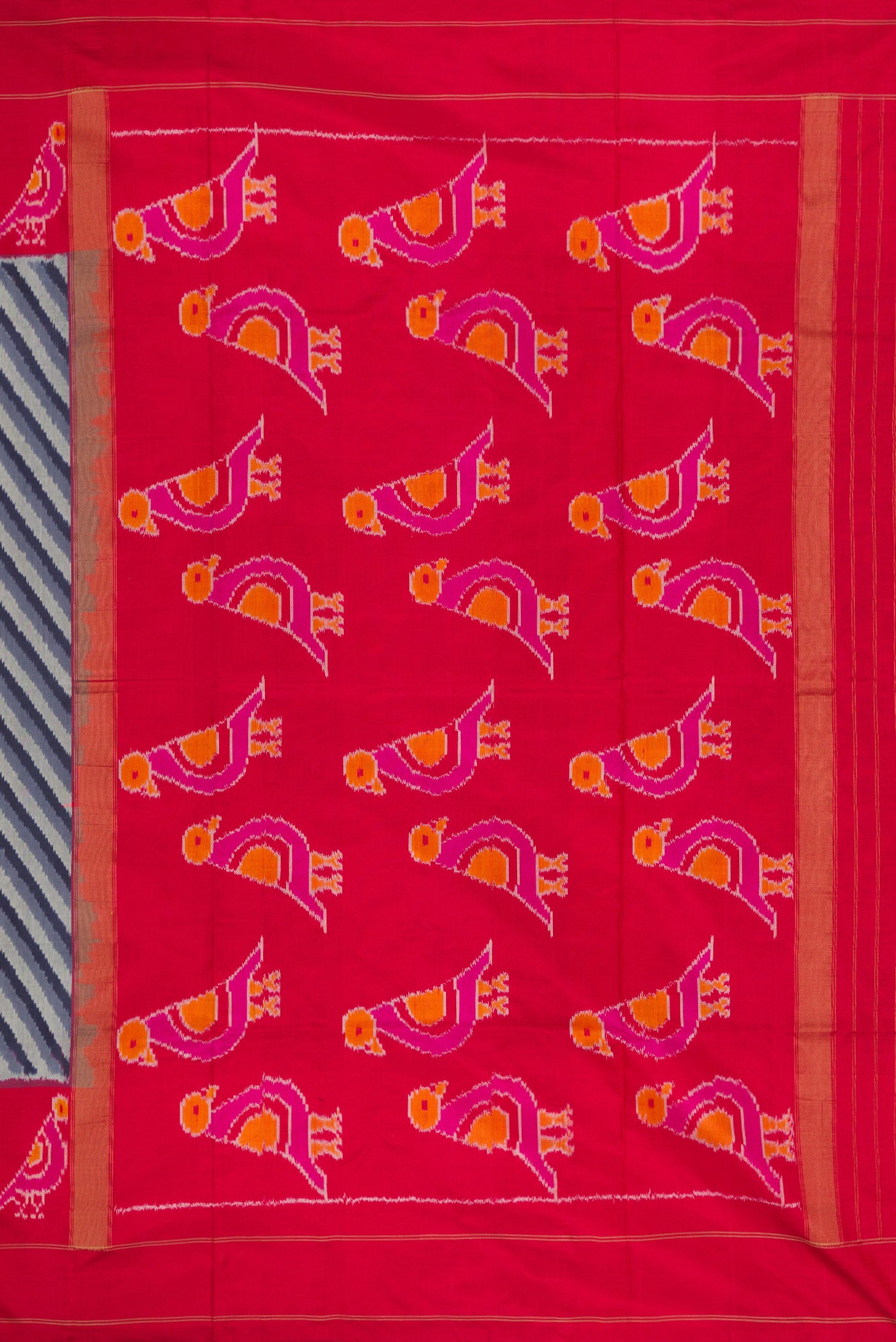 Close up image of the pallu of Grey Dual Tone Double Ikat Saree with Ikat Print on the body and Ikat Border. 