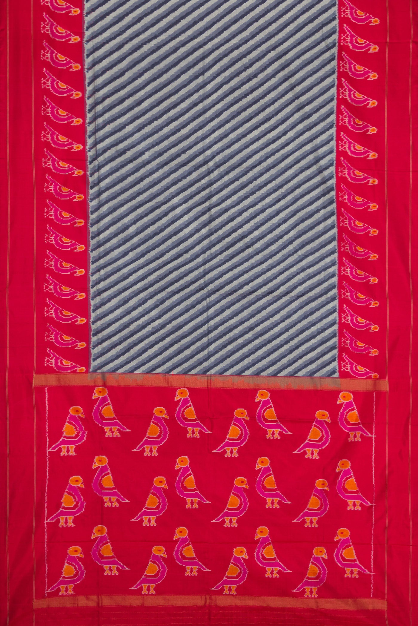 Flat view of Grey Dual Tone Double Ikat Saree with Ikat Print on the body and Ikat Border. 