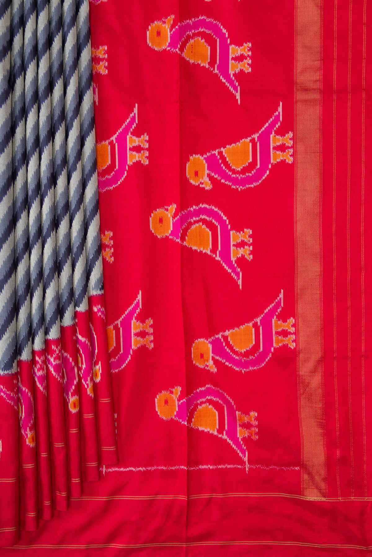 Pleats and pallu of Grey Dual Tone Double Ikat Saree with Ikat Print on the body and Ikat Border. 