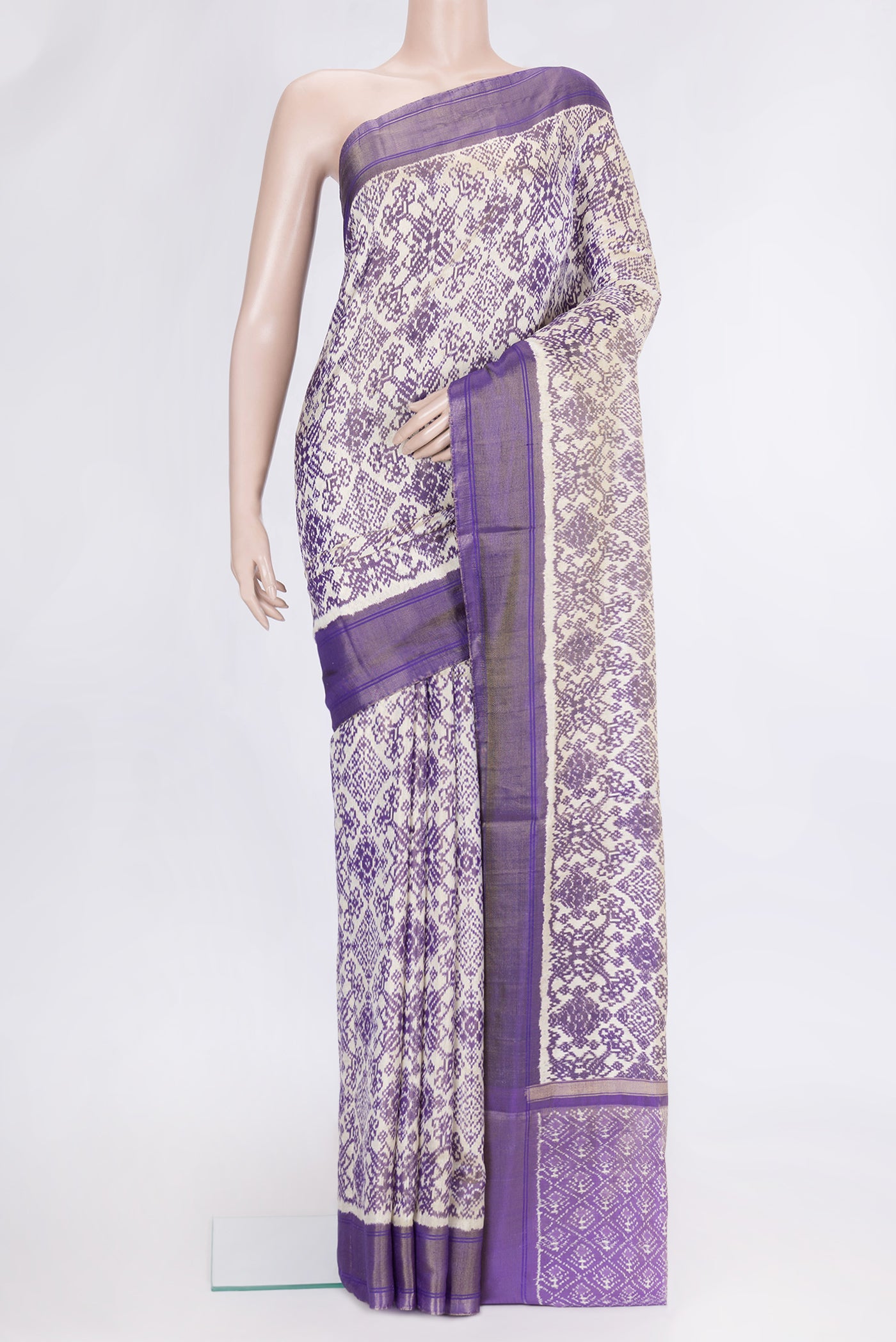 Off White Dual Tone Double Ikat Saree with Ikat Print on the body and Ikat Border.  displayed on a mannequin