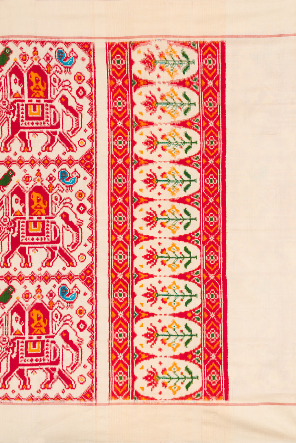 Close up image of the pallu of Sandal Dual Tone Double Ikat Saree with Ikat Print on the body and Plain Border. 