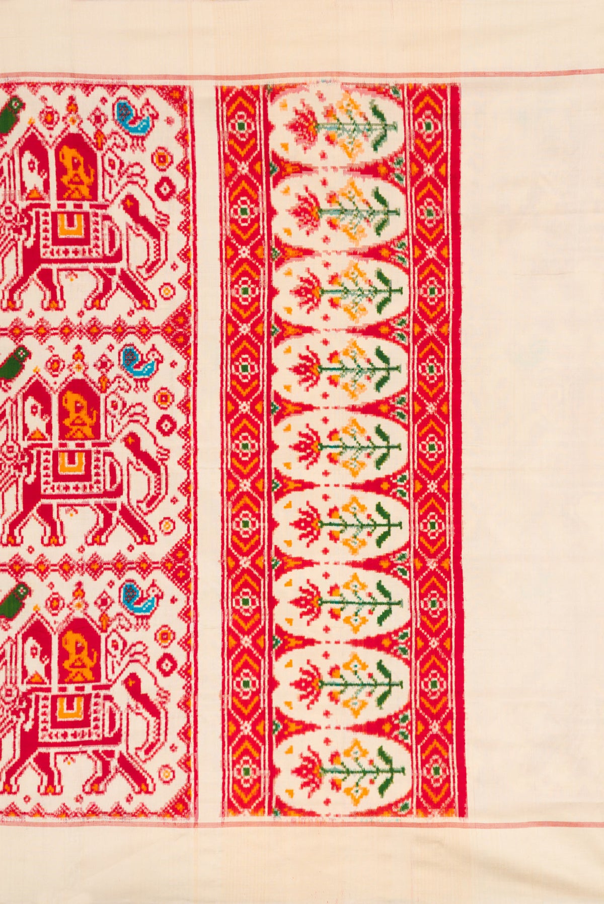 Close up image of the pallu of Sandal Dual Tone Double Ikat Saree with Ikat Print on the body and Plain Border. 