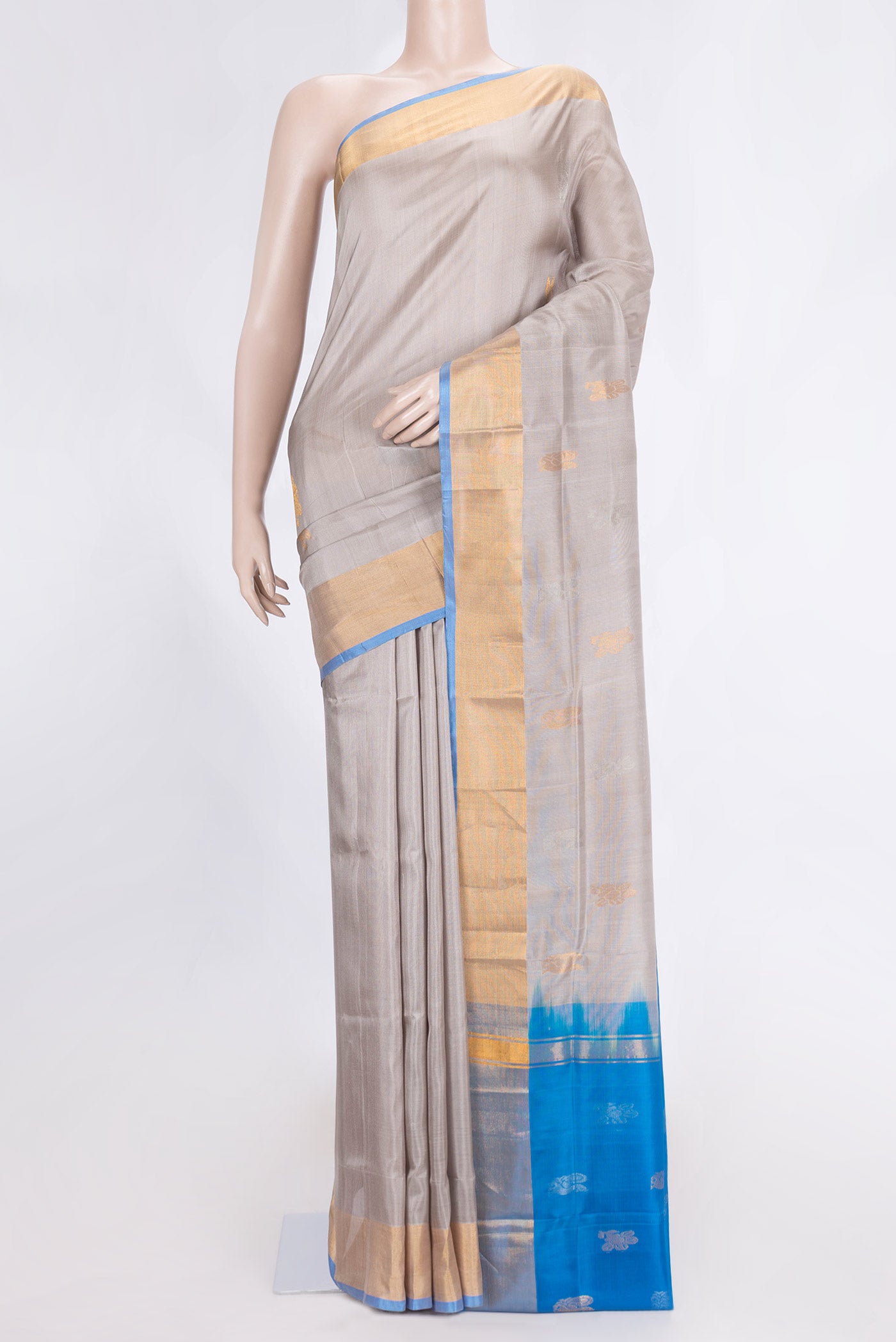 Grey Dual Tone Uppada Silk Saree with Zari Butta on the body and Zari Border.  displayed on a mannequin