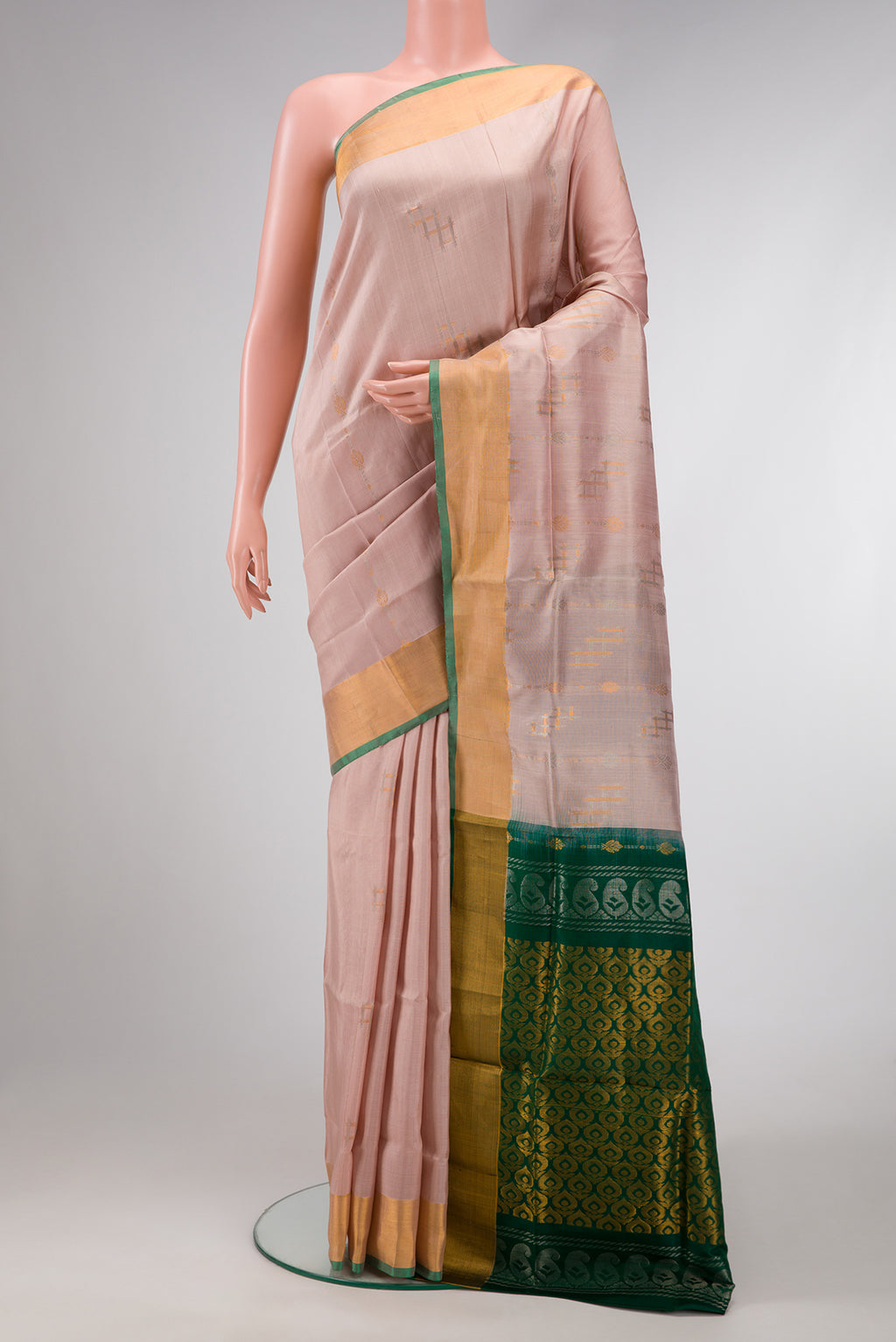 Rose Gold Dual Tone Uppada Silk Saree with Zari Butta on the body and Zari Border.  displayed on a mannequin