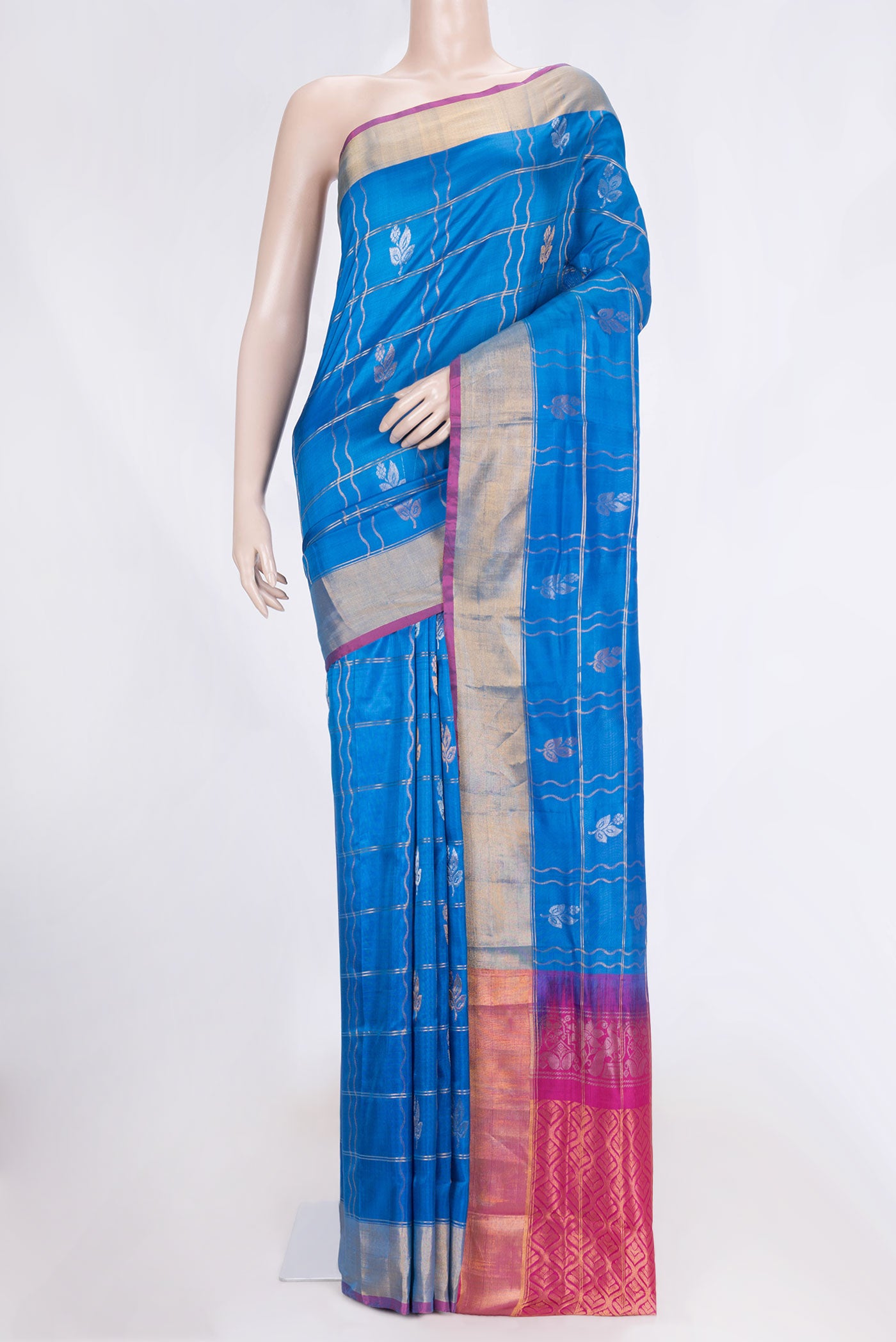 Royal Blue Dual Tone Uppada Silk Saree with Checked design on the body and Zari Border.  displayed on a mannequin