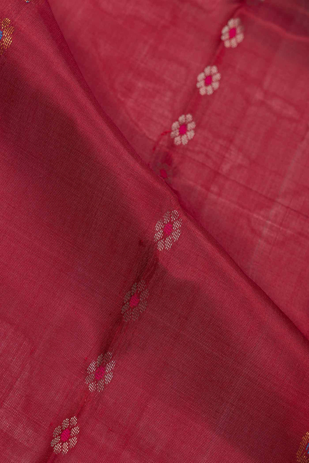 Close up of Maroon Dual Tone Uppada Silk Saree with Stripes on the body and Fancy Border.  displaying folds