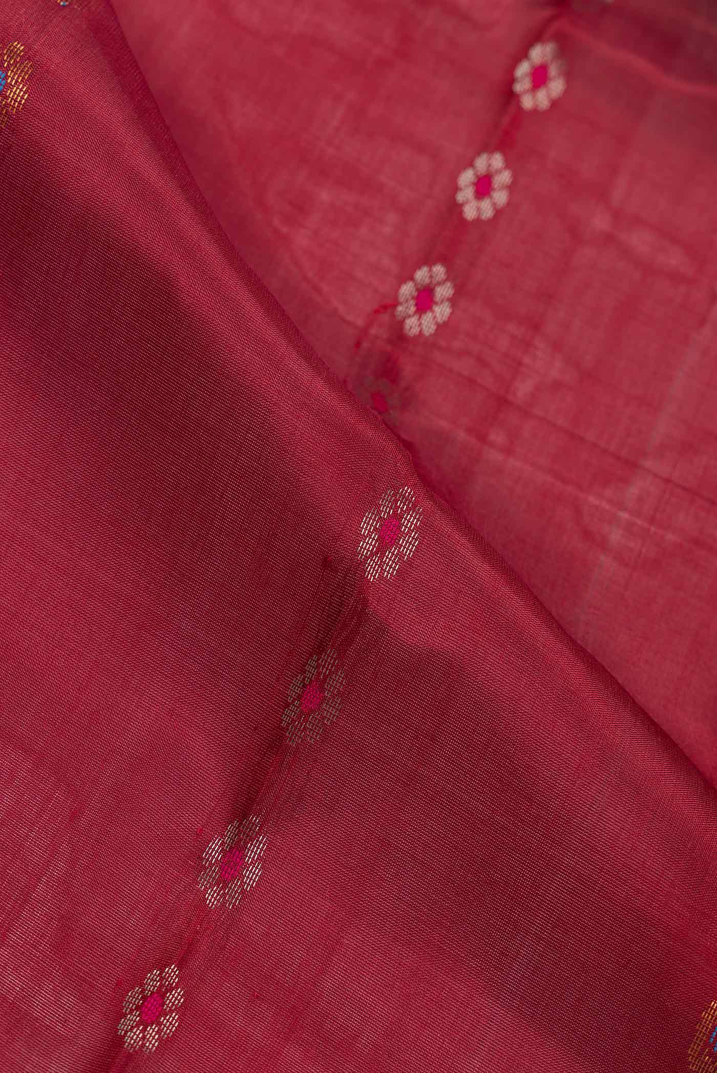 Close up of Maroon Dual Tone Uppada Silk Saree with Stripes on the body and Fancy Border.  displaying folds