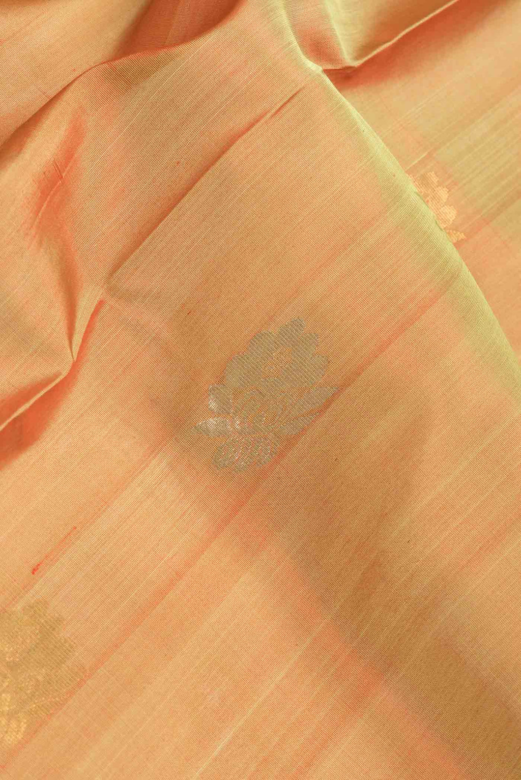 Close up of Mustard Dual Tone Uppada Silk Saree with Zari Butta on the body and Zari Border.  displaying folds