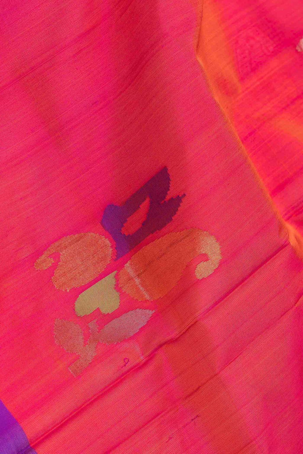 Close up of Pink Dual Tone Uppada Silk Saree with Zari And Thread Butta on the body and Fancy Border.  displaying folds