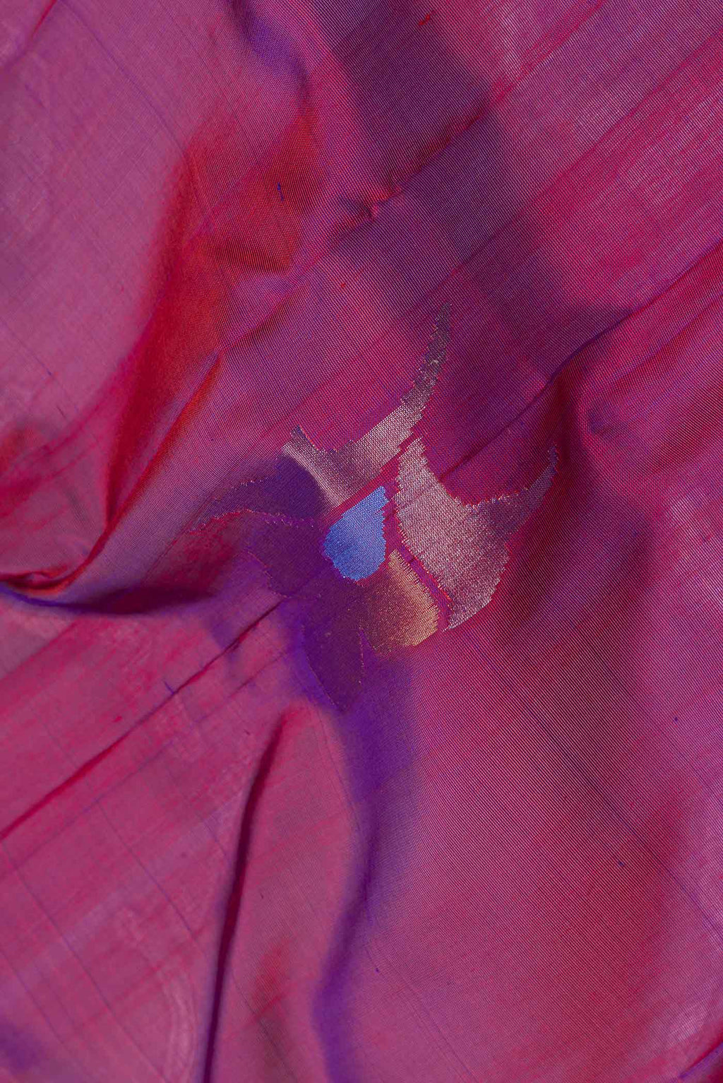 Close up of Purple Dual Tone Uppada Silk Saree with Zari Butta on the body and Fancy Border.  displaying folds