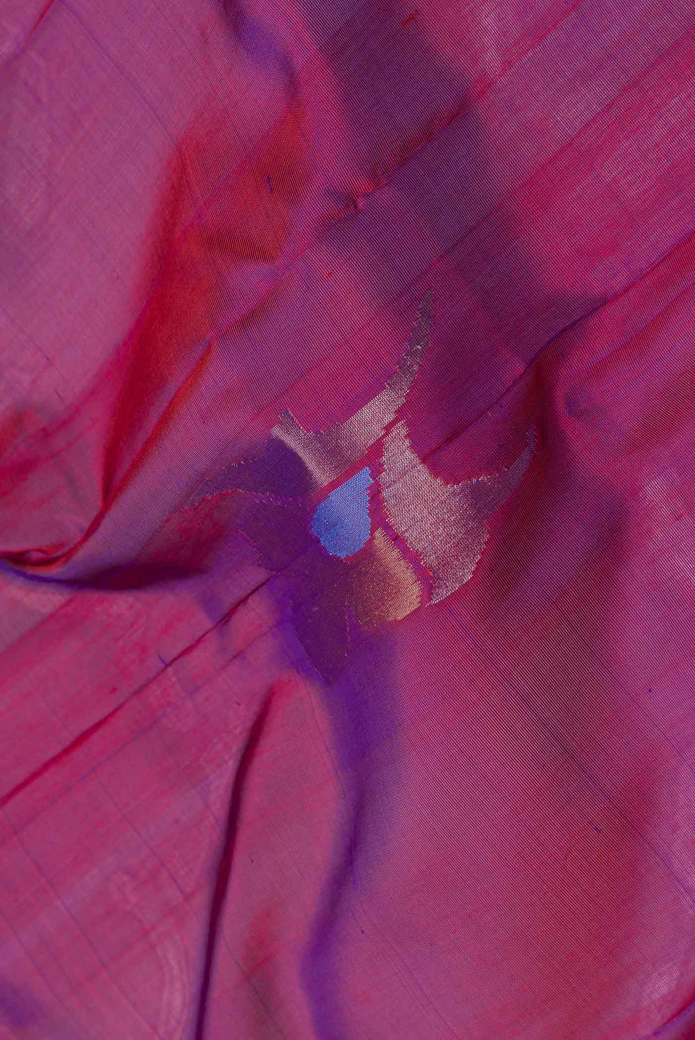 Close up of Purple Dual Tone Uppada Silk Saree with Zari Butta on the body and Fancy Border.  displaying folds