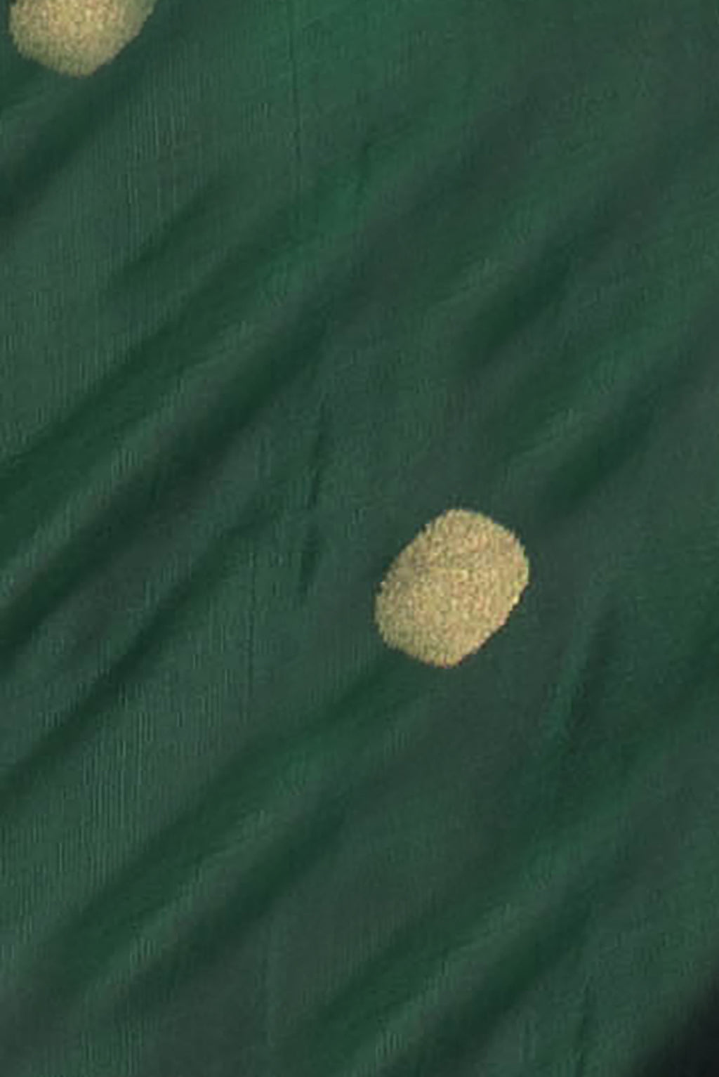 Close up of Bottle Green Dual Tone Uppada Silk Saree with Zari Butta on the body and Zari Border.  displaying folds