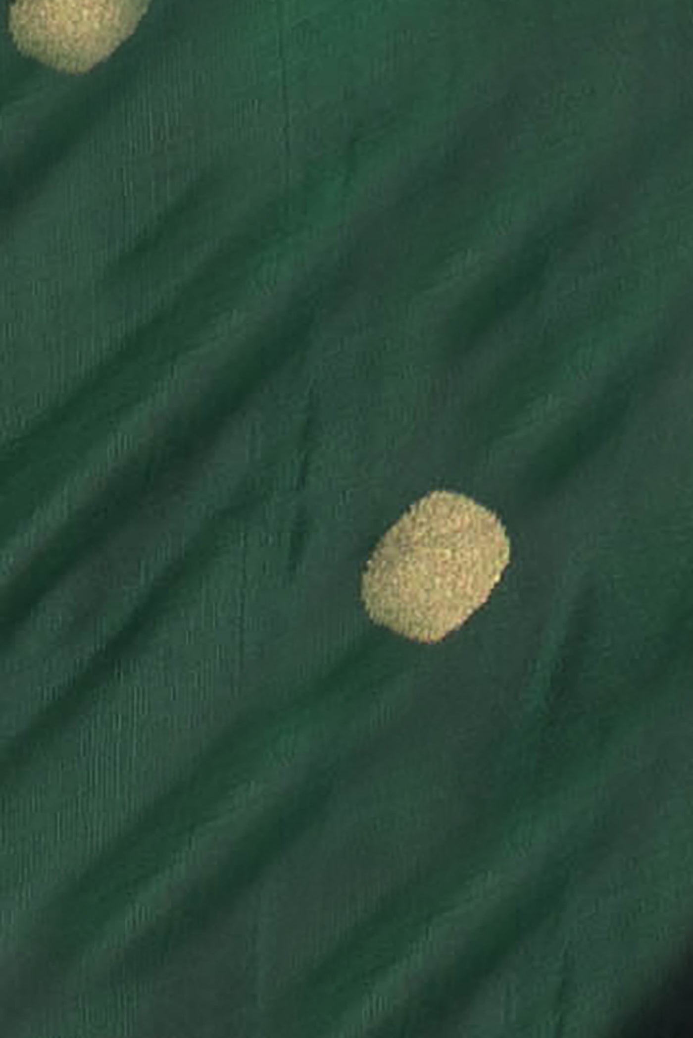 Close up of Bottle Green Dual Tone Uppada Silk Saree with Zari Butta on the body and Zari Border.  displaying folds