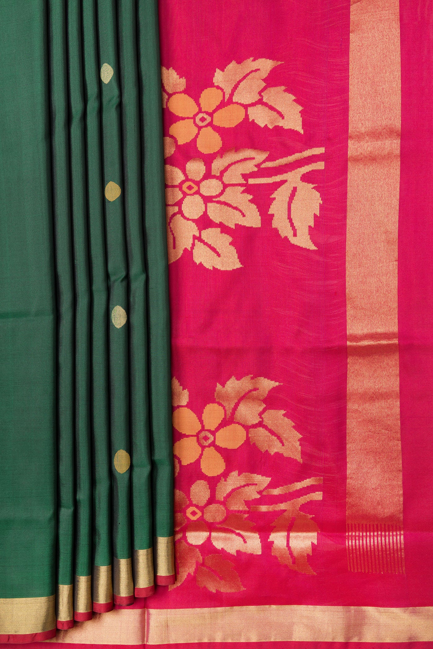 Pleats and pallu of Bottle Green Dual Tone Uppada Silk Saree with Zari Butta on the body and Zari Border. 