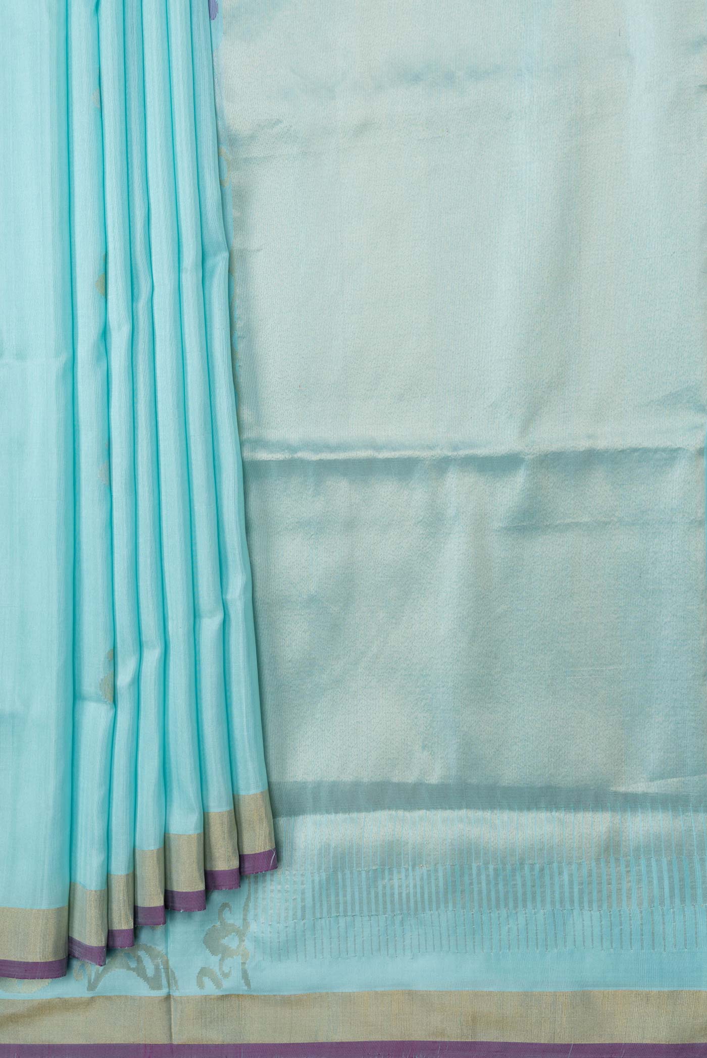 Pleats and pallu of Sky Blue Dual Tone Uppada Silk Saree with Zari Butta on the body and Zari Border. 