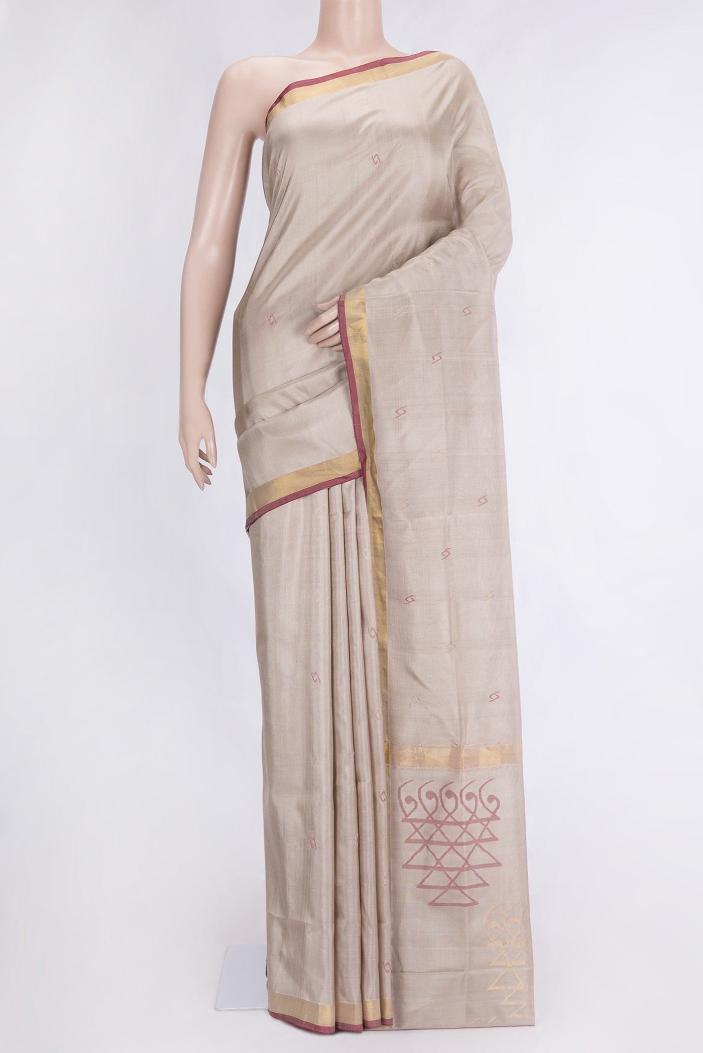 Beige Dual Tone Uppada Silk Saree with Zari And Thread Butta on the body and Zari Border.  displayed on a mannequin