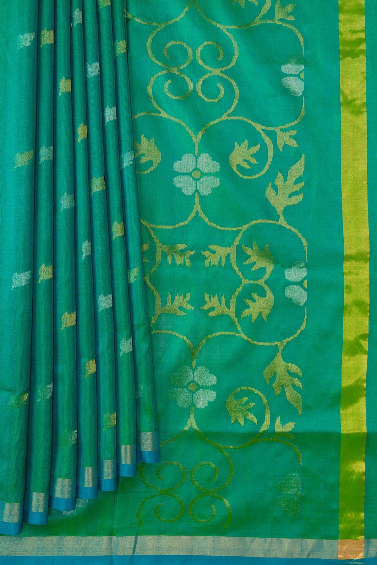 Pleats and pallu of Green Dual Tone Uppada Silk Saree with Zari Butta on the body and Zari Border. 
