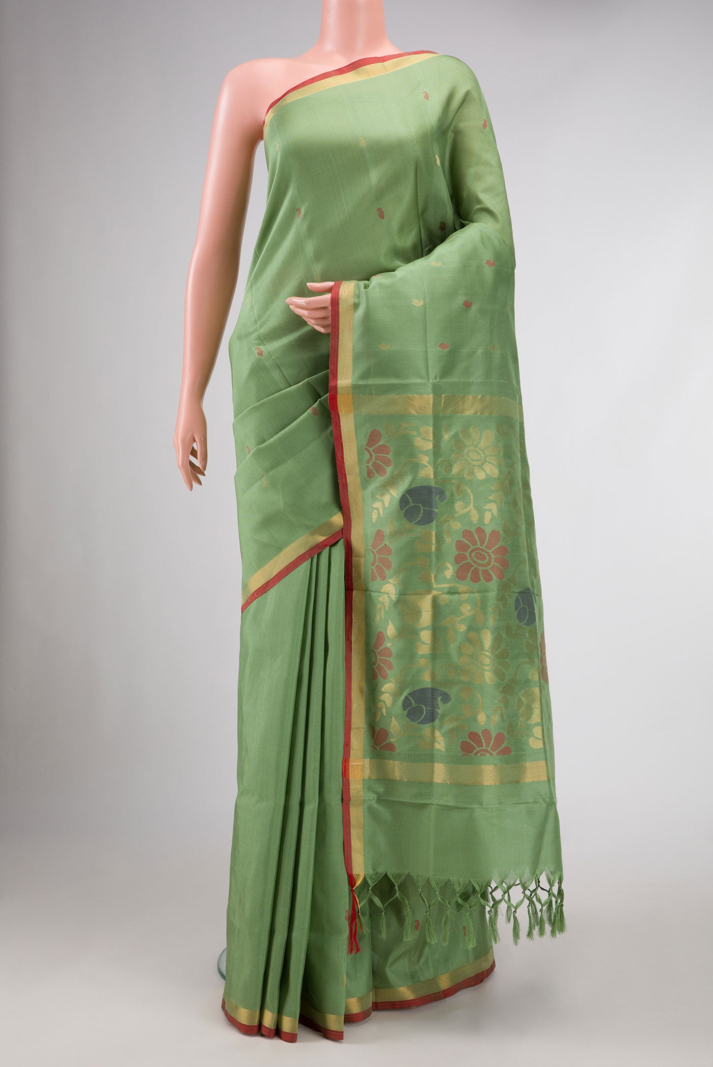 Green Dual Tone Uppada Silk Saree with Zari And Thread Butta on the body and Zari Border.  displayed on a mannequin