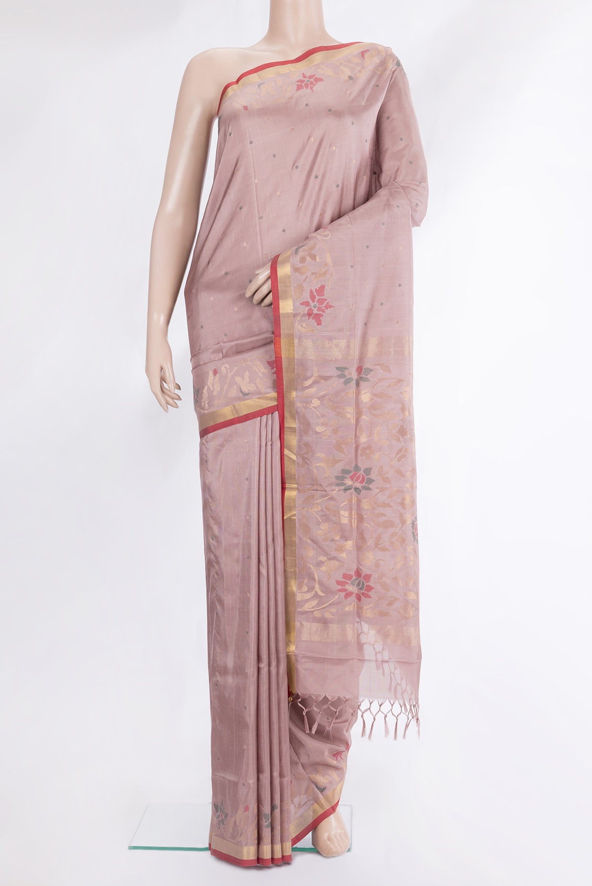 Pure Silk Rose Gold Uppada Saree with Zari And Thread Butta on the body and Zari Border.  displayed on a mannequin