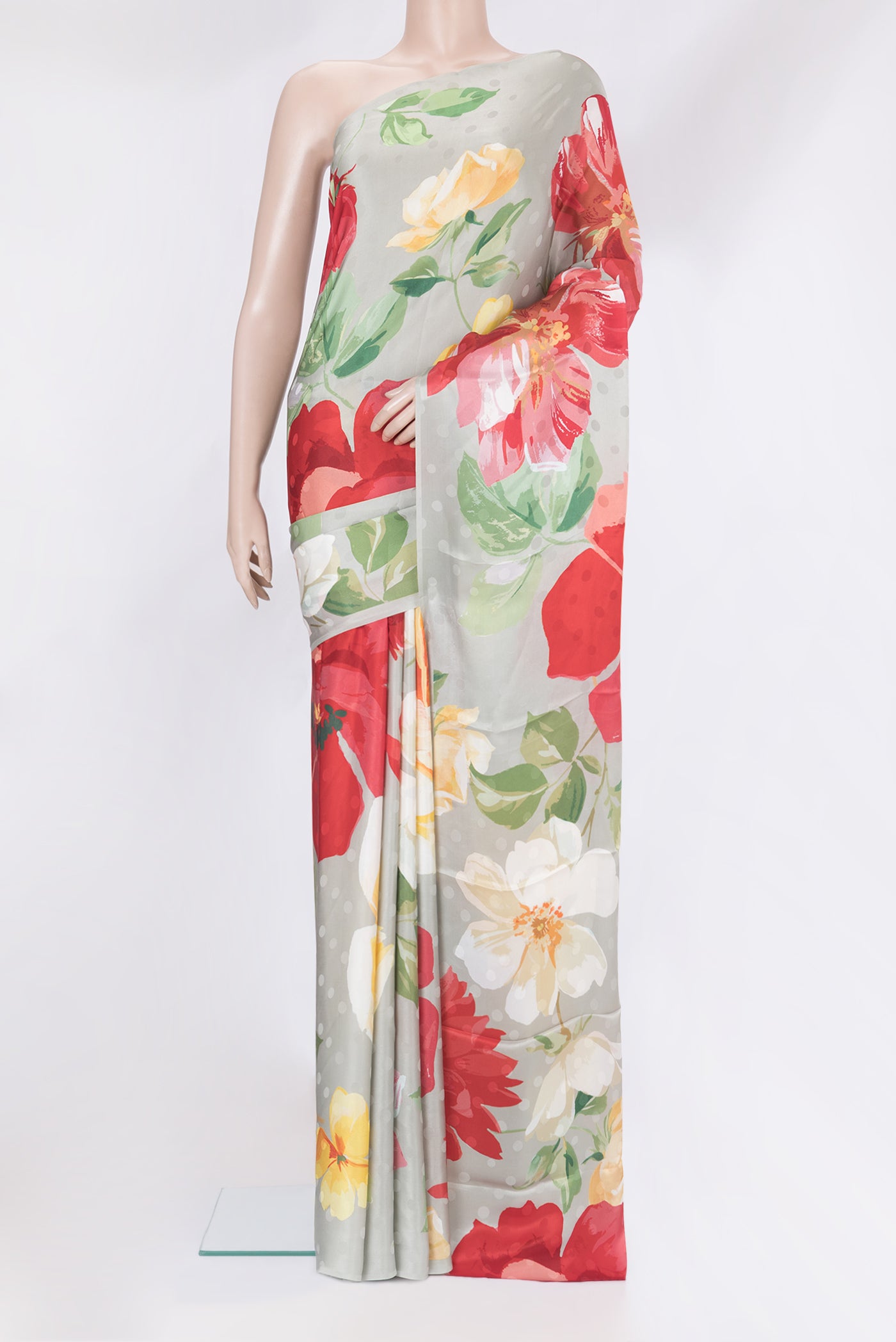 Grey Crepe Saree with Printed design on the body and Without Border.  displayed on a mannequin
