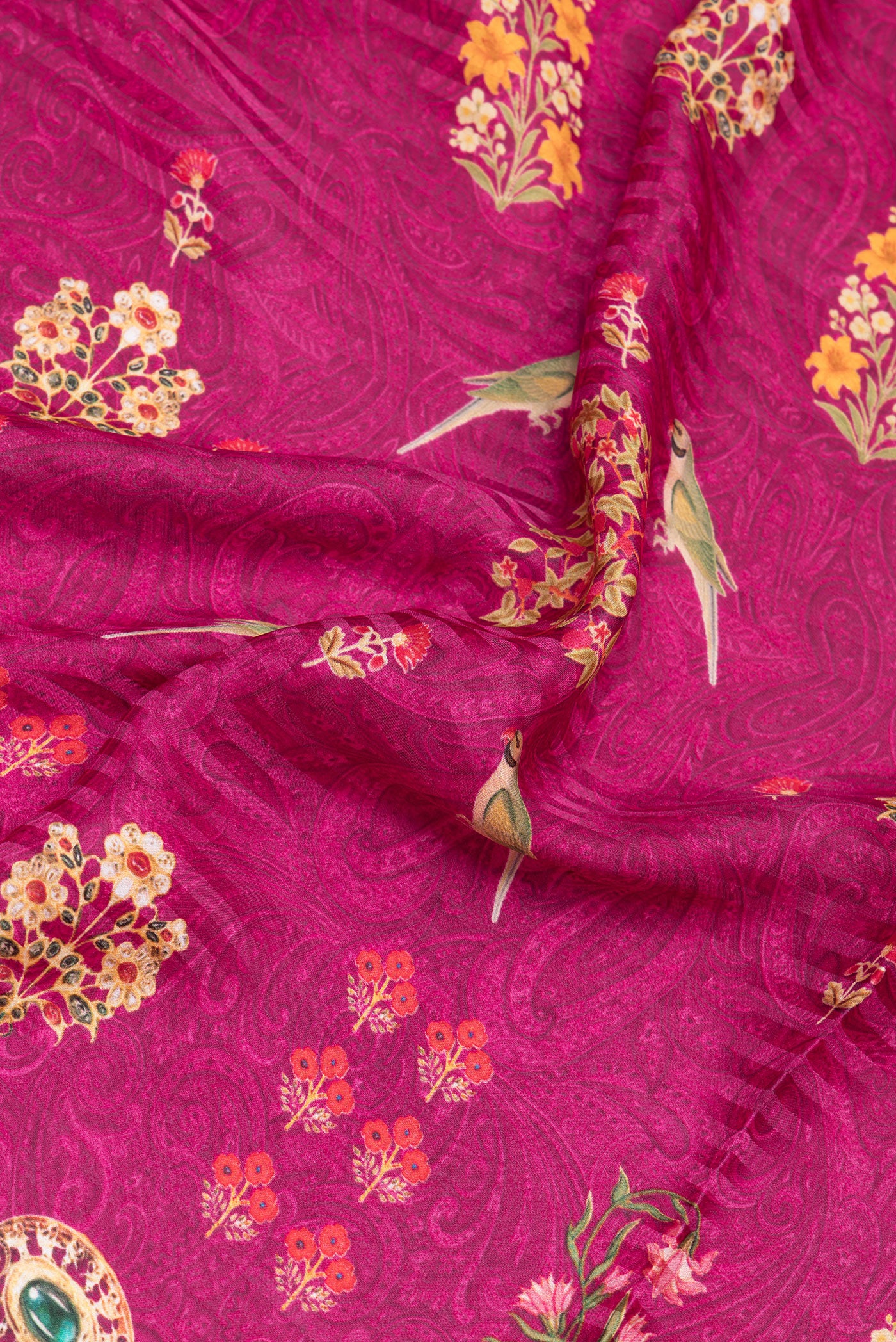 Close up of Magenta Crepe Saree with Printed design on the body and Without Border.  displaying folds