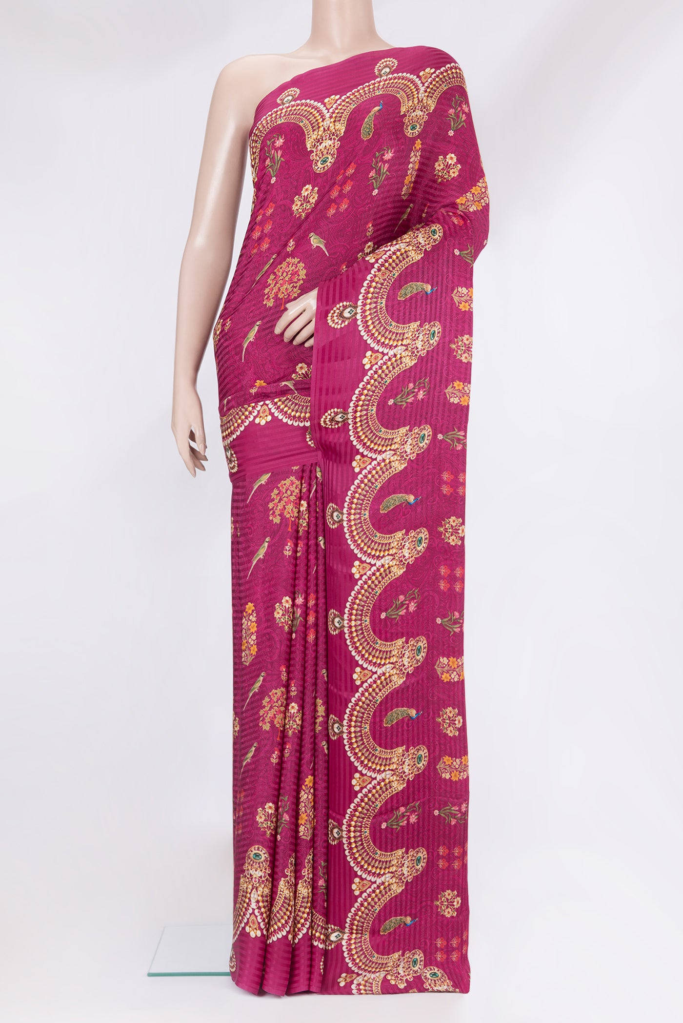 Magenta Crepe Saree with Printed design on the body and Without Border.  displayed on a mannequin