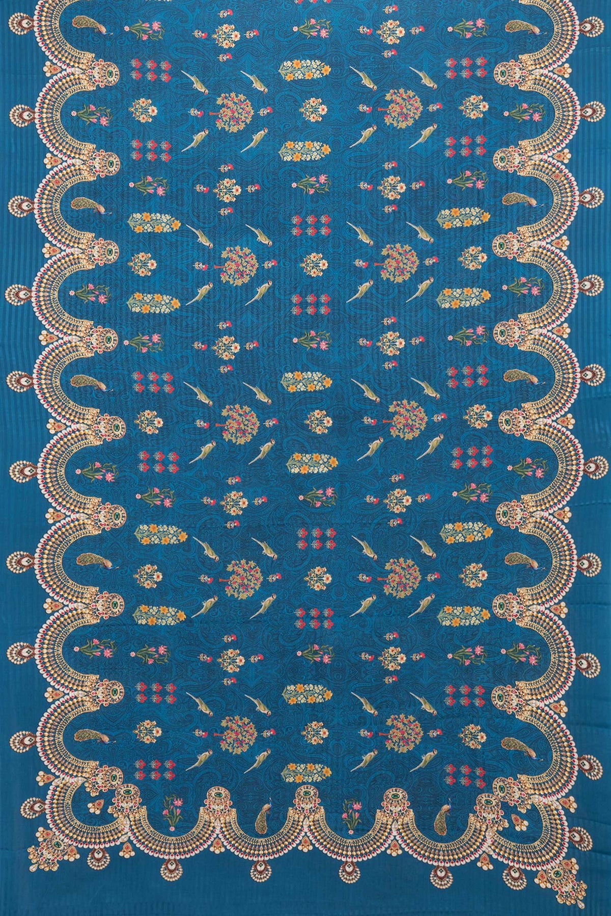 Flat view of Peacock Blue Dual Tone Mysore Crepe Saree with Printed design on the body and Printed Border. 