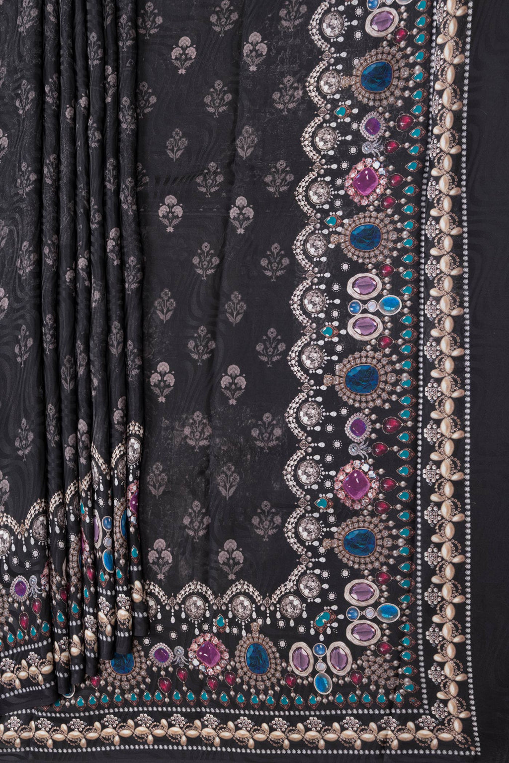 Pleats and pallu of Black Dual Tone Mysore Crepe Saree with Printed design on the body and Printed Border. 