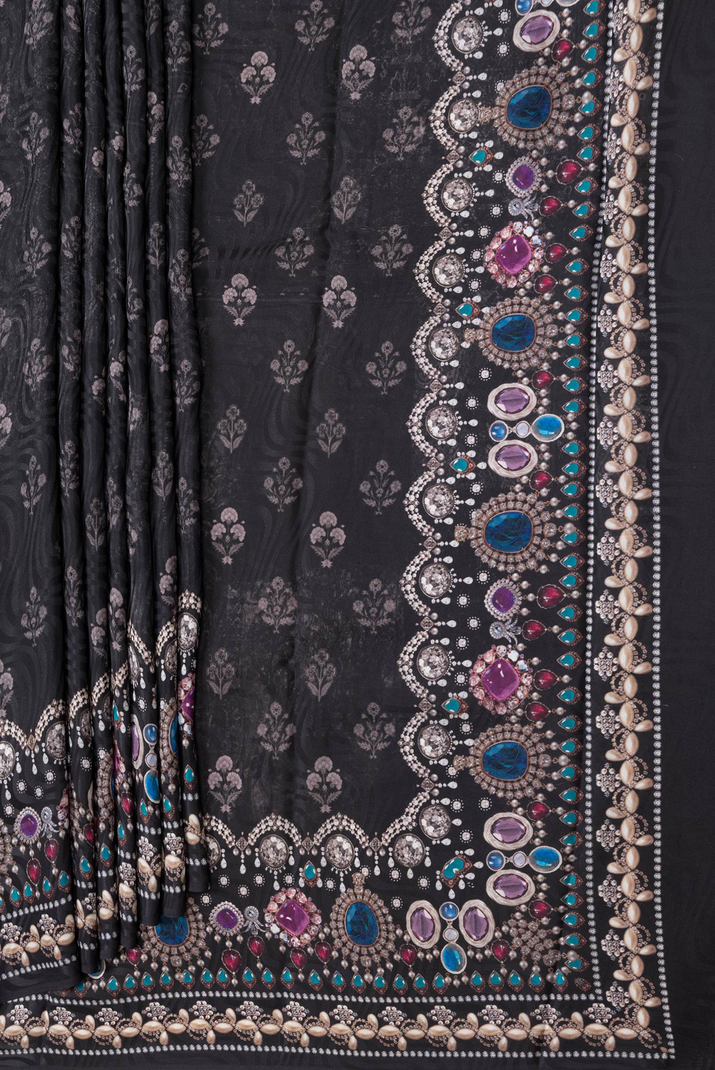 Pleats and pallu of Black Dual Tone Mysore Crepe Saree with Printed design on the body and Printed Border. 
