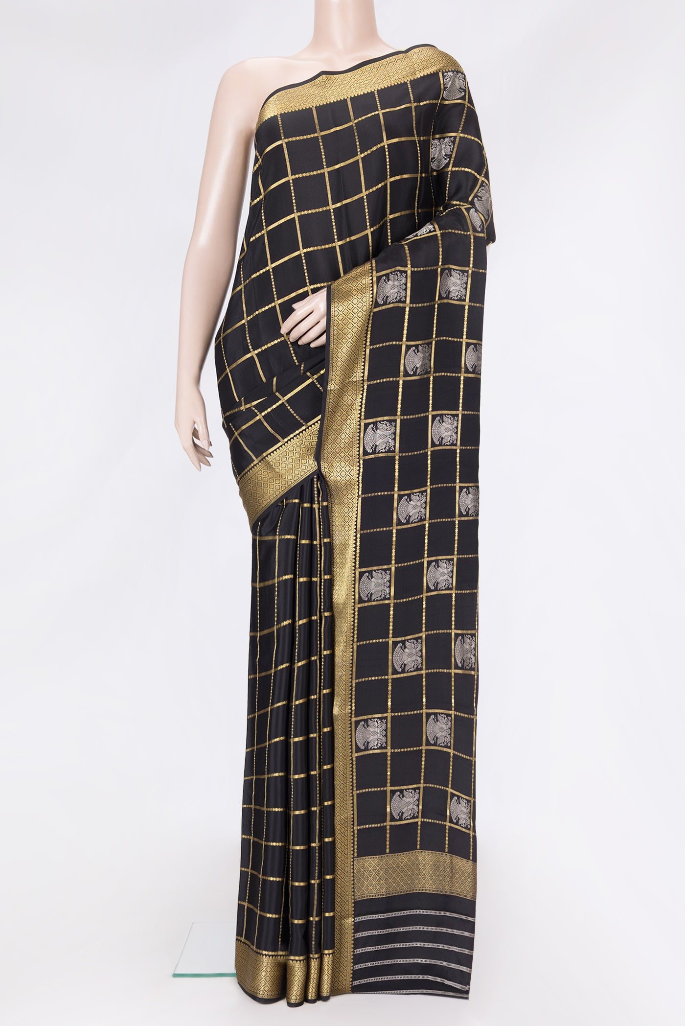 Black Dual Tone Mysore Silk Saree with Checked design on the body and Zari Border.  displayed on a mannequin