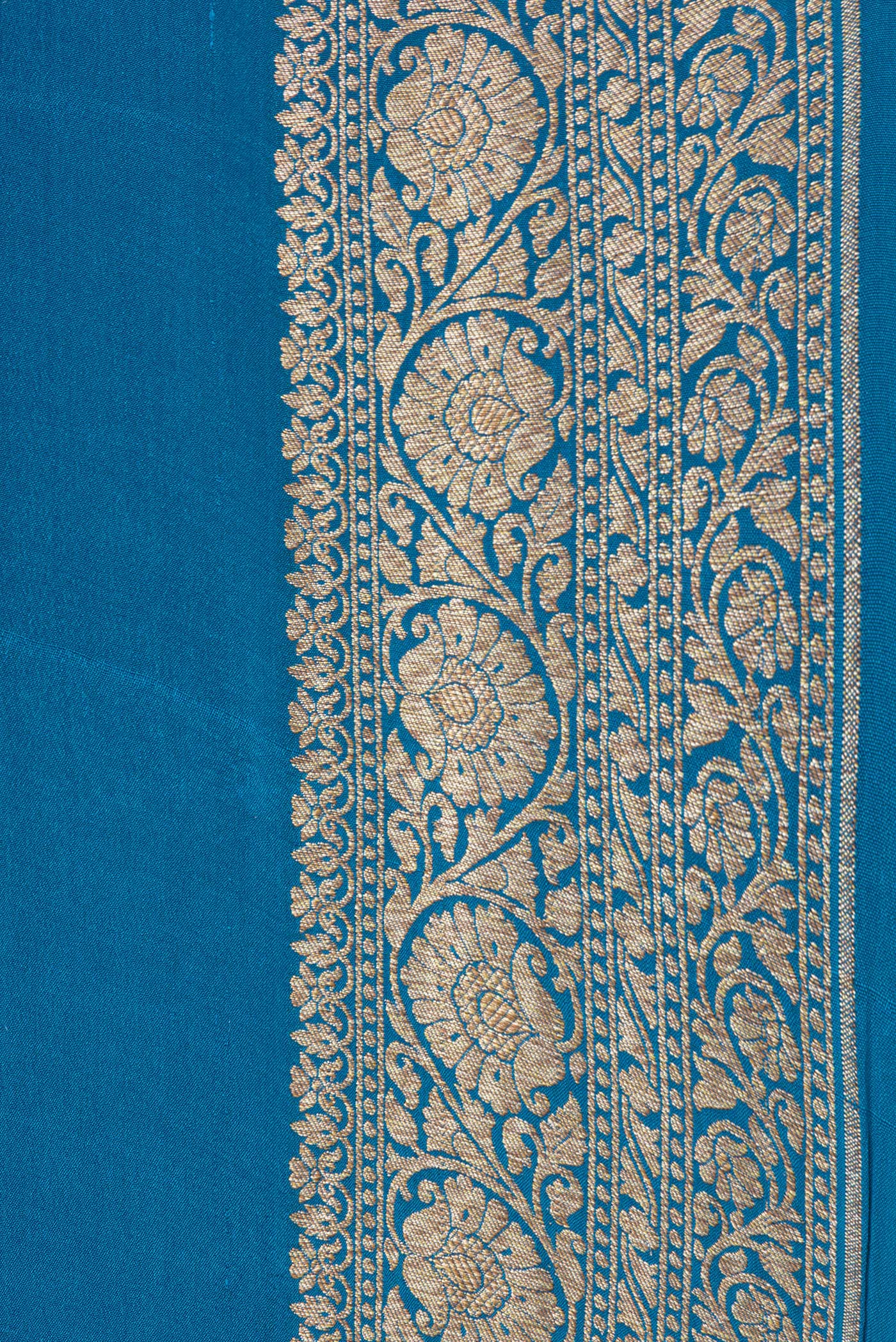 Border image of Peacock Blue Dual Tone Mysore Georgette Saree with Plain Body and Zari Border. 