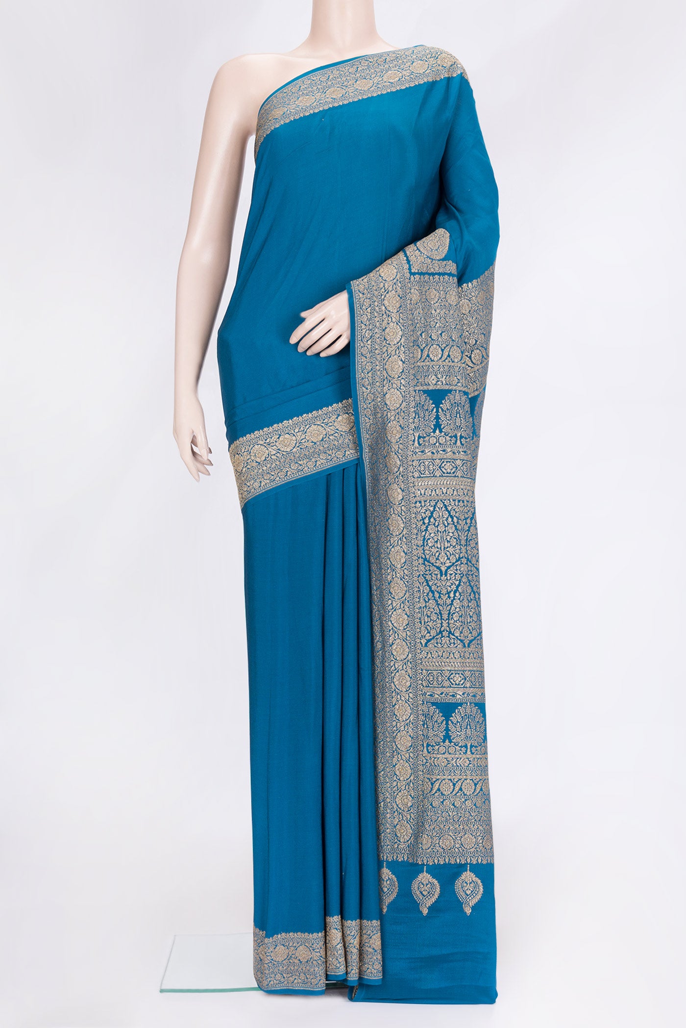 Peacock Blue Dual Tone Mysore Georgette Saree with Plain Body and Zari Border.  displayed on a mannequin