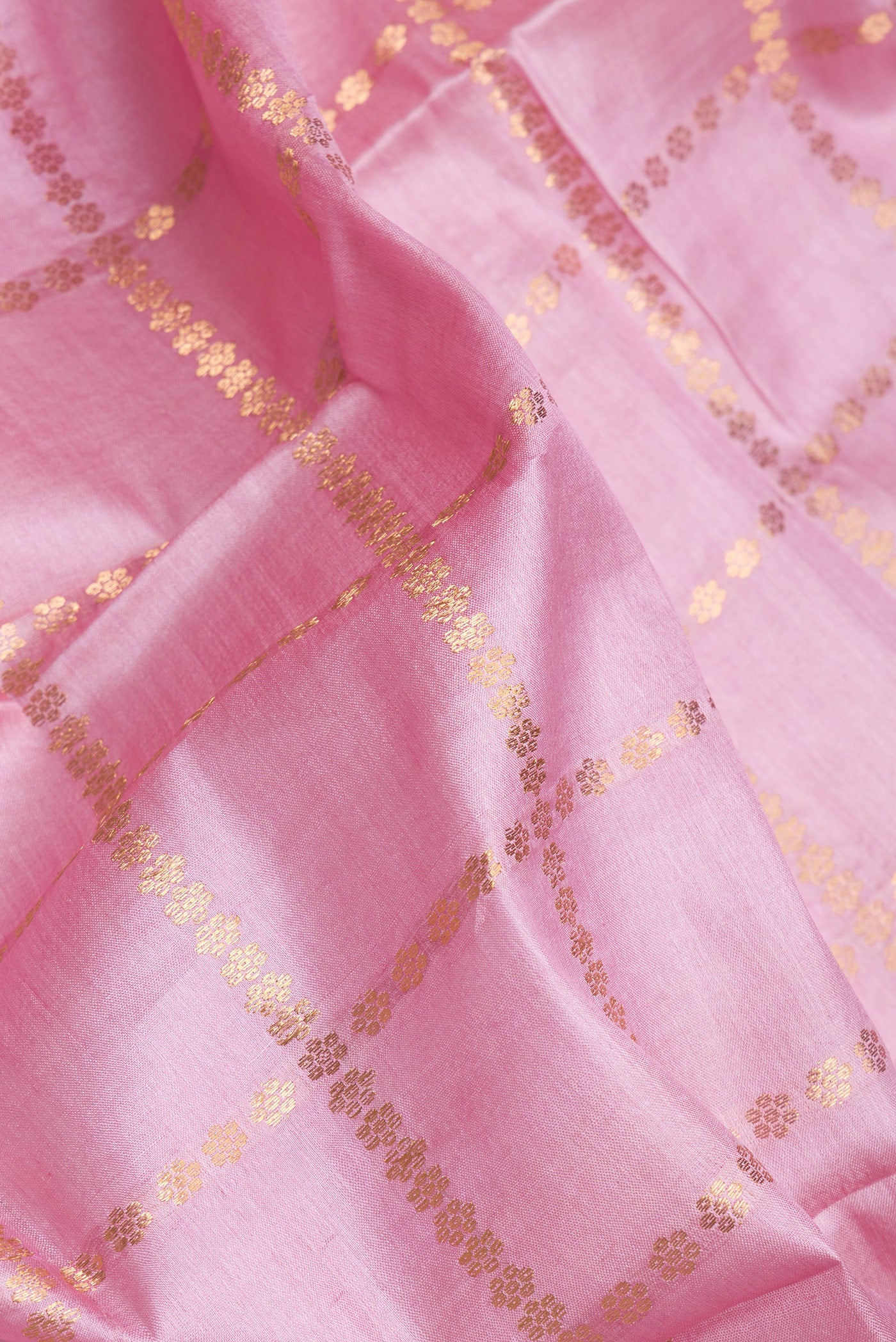 Close up of Pink Dual Tone Tussar Silk Saree with Checked design on the body and Zari Border.  displaying folds