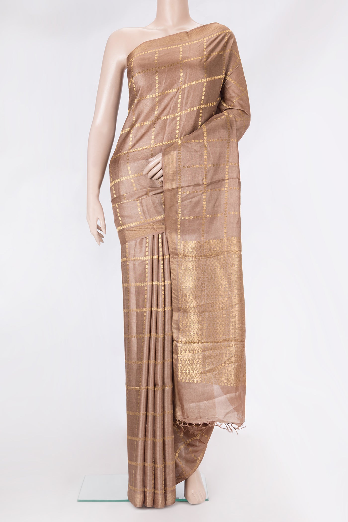 Brown Dual Tone Tussar Silk Saree with Checked design on the body and Zari Border.  displayed on a mannequin