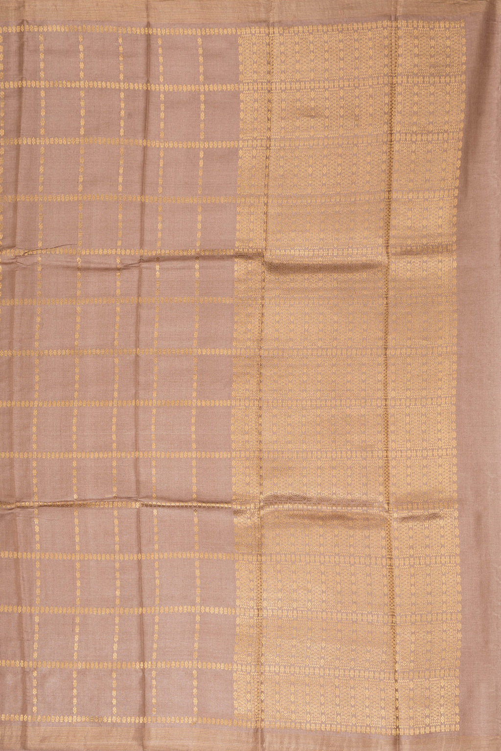 Close up image of the pallu of Brown Dual Tone Tussar Silk Saree with Checked design on the body and Zari Border. 