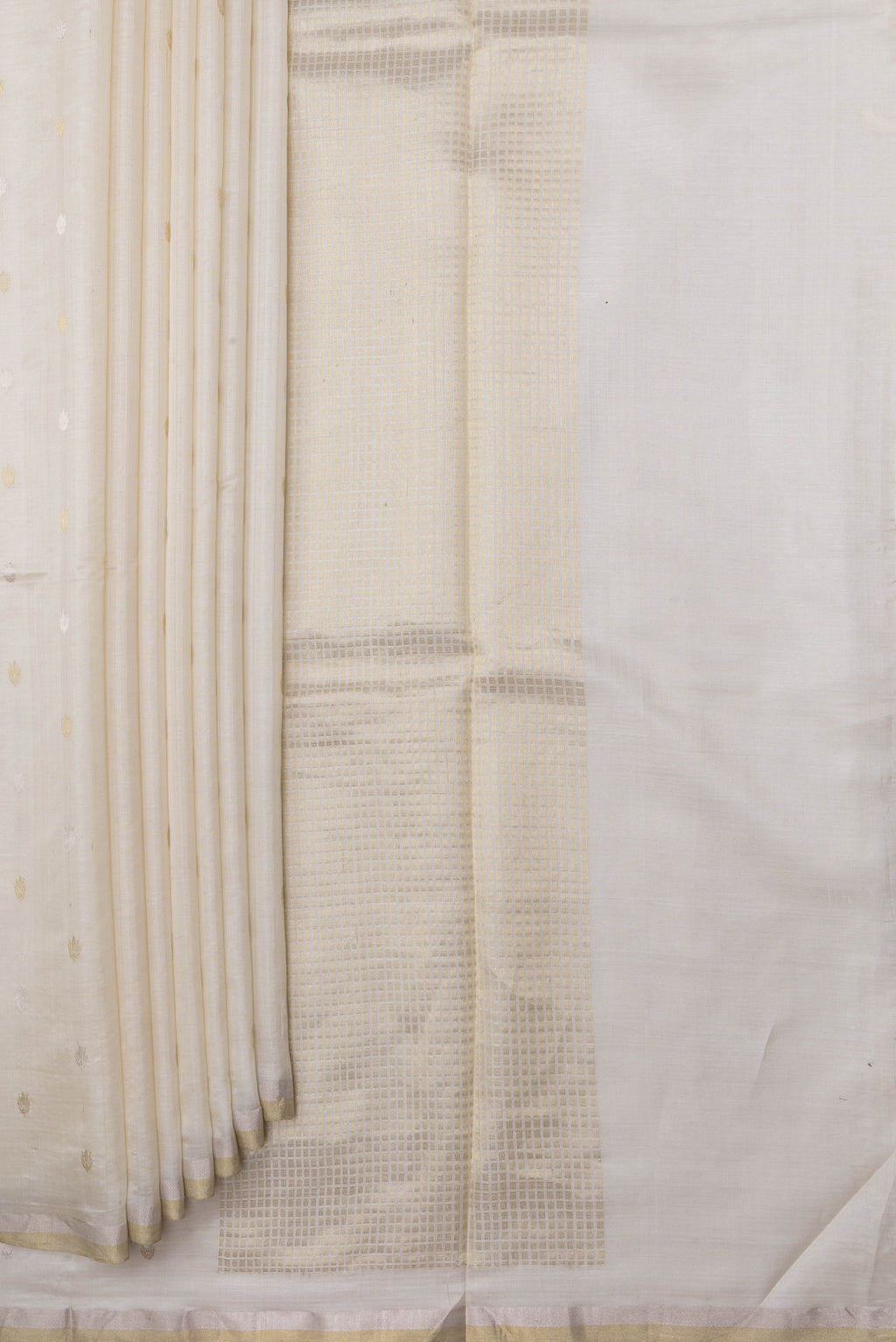 Pleats and pallu of Off White Tussar Silk Saree with Zari Butta on the body and Zari Border. 