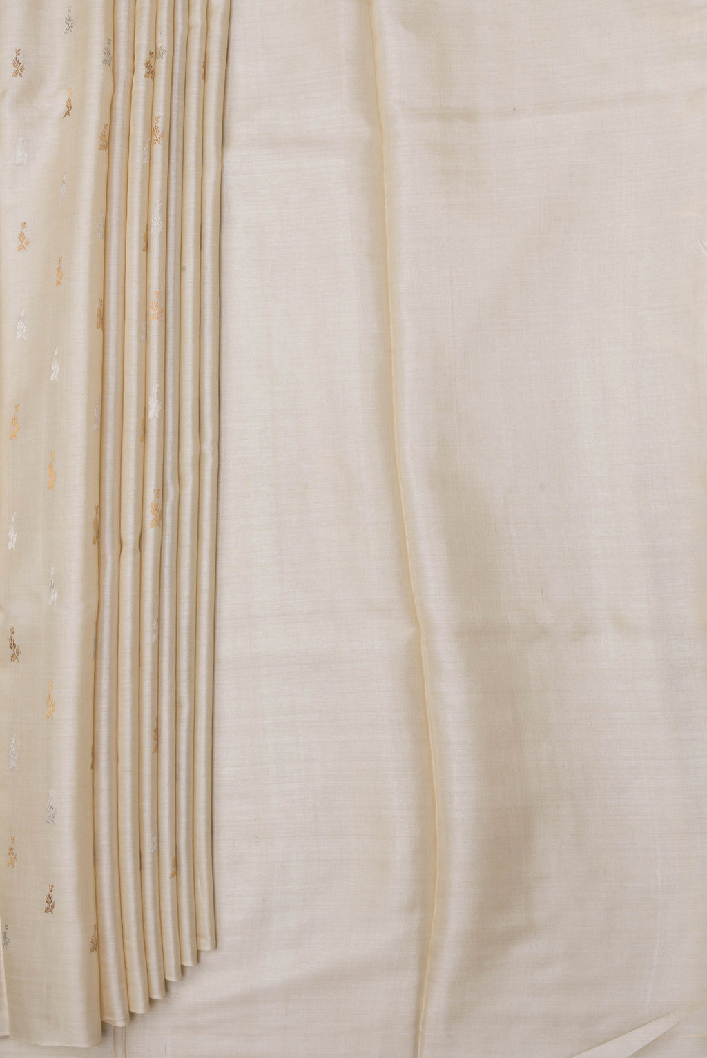 Pleats and pallu of Off White Dual Tone Tussar Silk Saree with Zari Butta on the body and Without Border. 