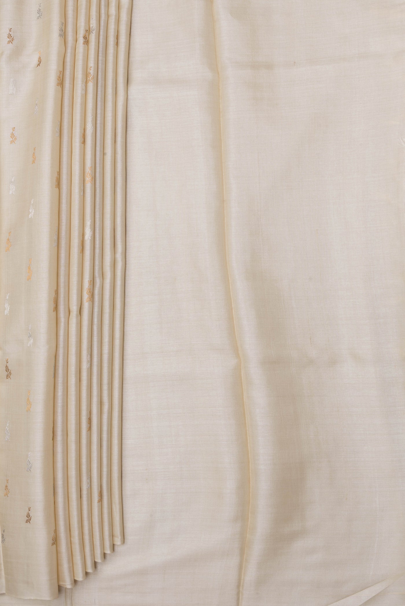 Pleats and pallu of Off White Dual Tone Tussar Silk Saree with Zari Butta on the body and Without Border. 