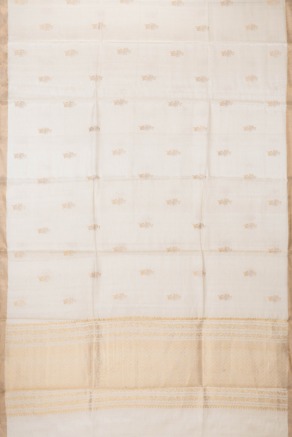 Flat view of Beige Dual Tone Tussar Silk Saree with Zari Butta on the body and Zari Border. 