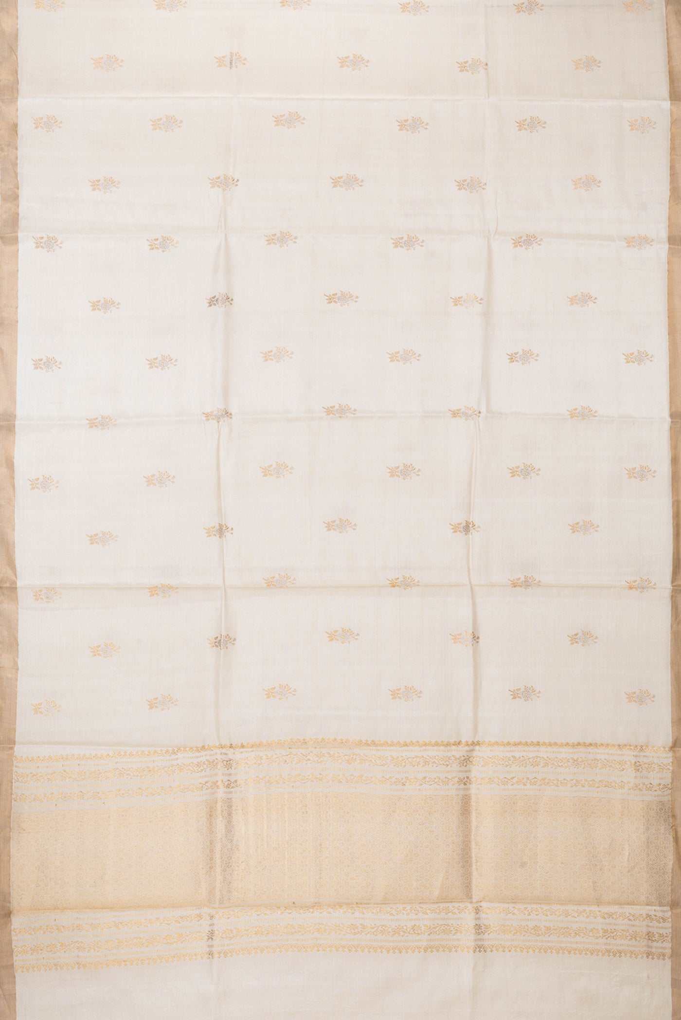 Flat view of Beige Dual Tone Tussar Silk Saree with Zari Butta on the body and Zari Border. 