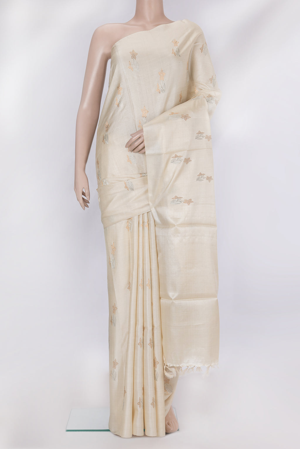 Off White Tussar Silk Saree with Zari Butta on the body and Without Border.  displayed on a mannequin