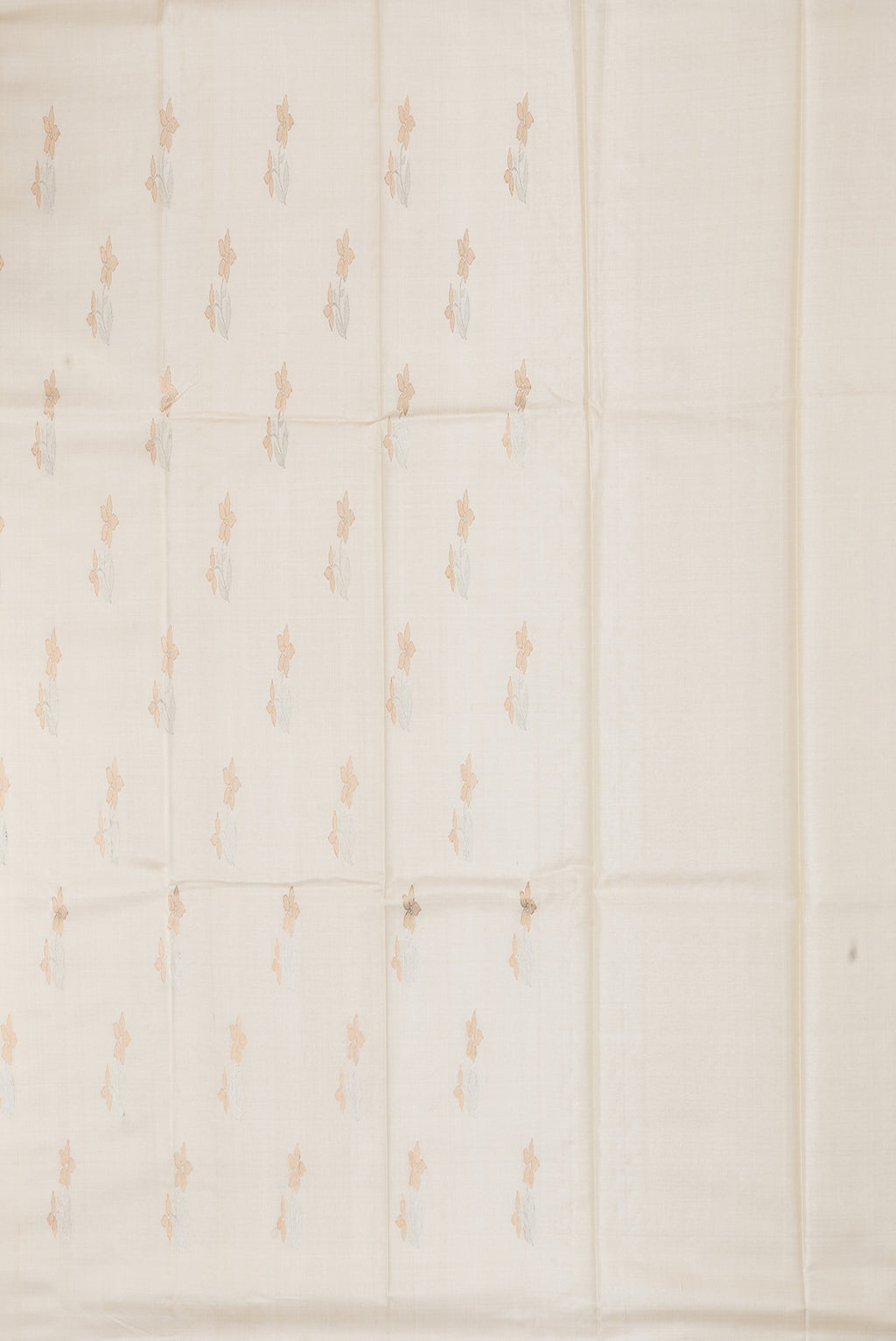 Close up image of the pallu of Off White Tussar Silk Saree with Zari Butta on the body and Without Border. 