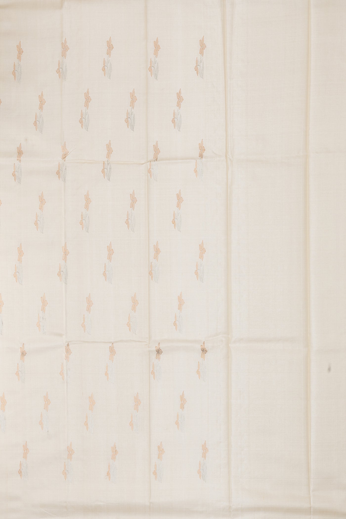 Close up image of the pallu of Off White Tussar Silk Saree with Zari Butta on the body and Without Border. 