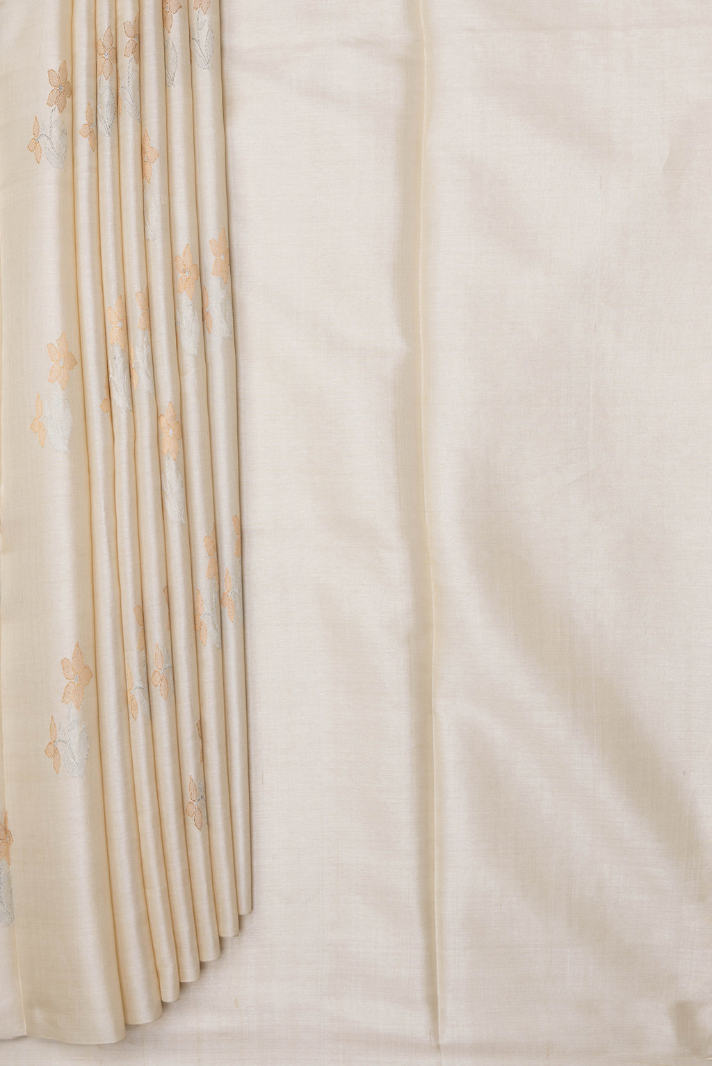 Pleats and pallu of Off White Tussar Silk Saree with Zari Butta on the body and Without Border. 