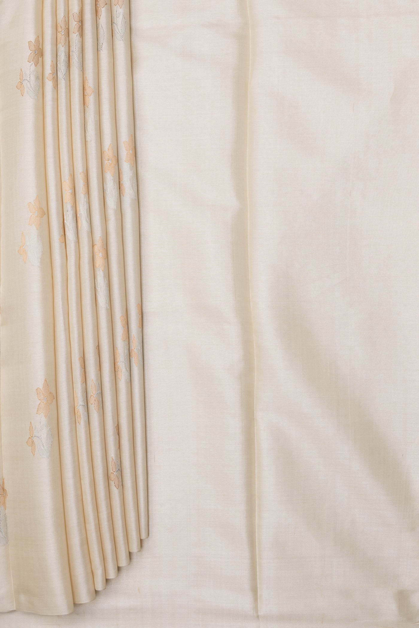 Pleats and pallu of Off White Tussar Silk Saree with Zari Butta on the body and Without Border. 