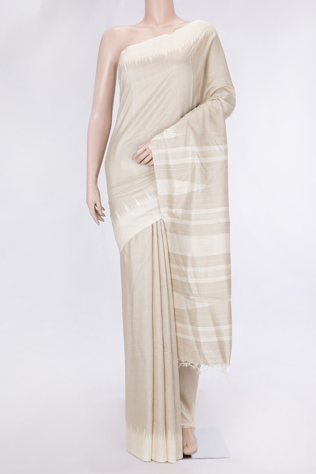 Beige Dual Tone Tussar Silk Saree with Plain Body and Printed Border.  displayed on a mannequin