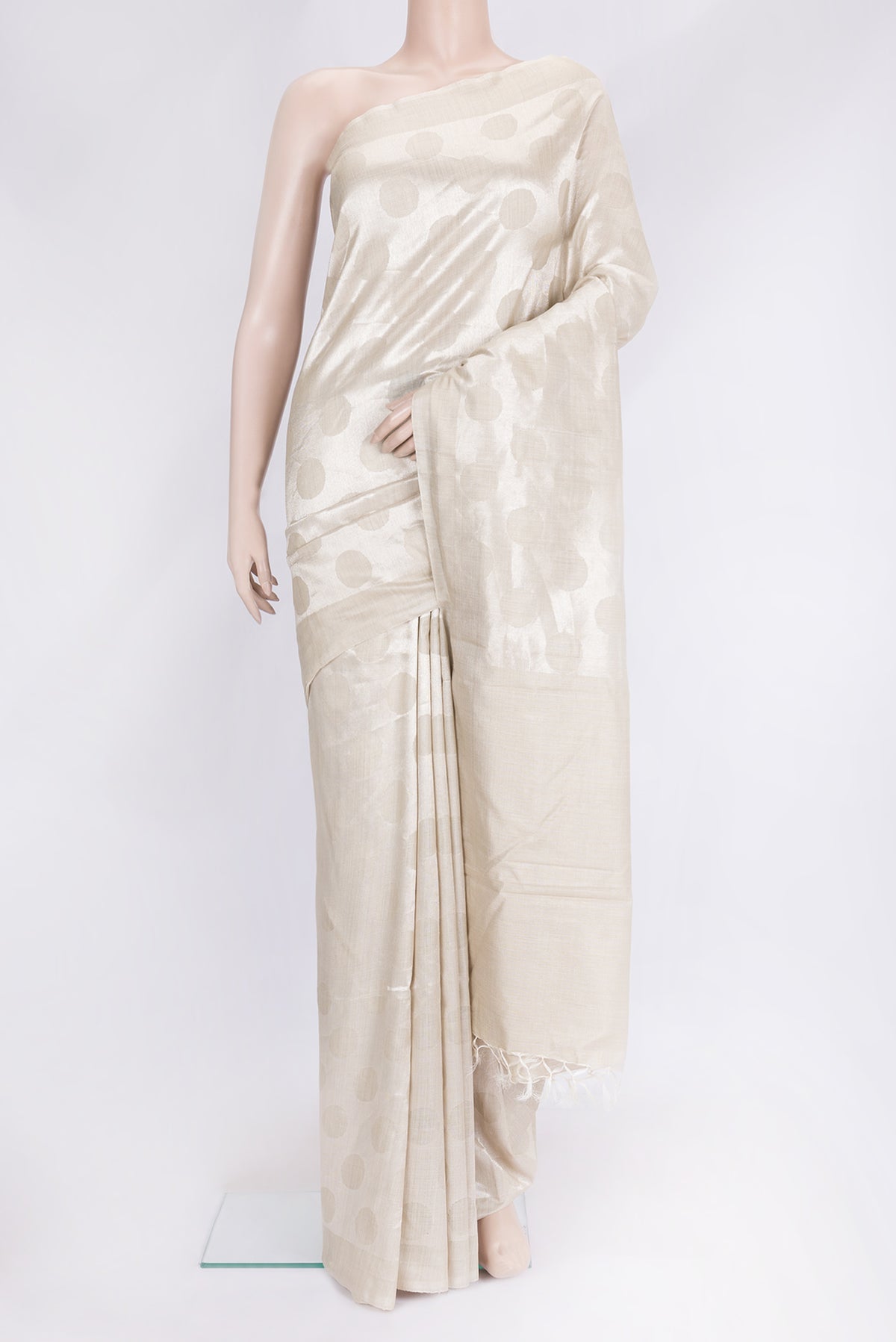 Beige Dual Tone Tussar Silk Saree with Zari Brocade on the body and Plain Border.  displayed on a mannequin